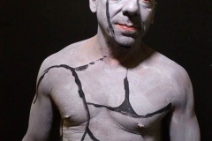 Andy Golub  Artist paints models for a living mural in his art space.