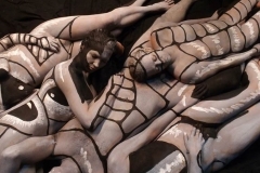Andy Golub  Artist paints models for a living mural in his art space.