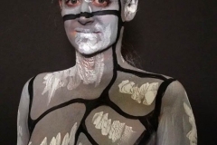 Andy Golub  Artist paints models for a living mural in his art space.