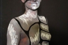 Andy Golub  Artist paints models for a living mural in his art space.