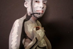 Andy Golub  Artist paints models for a living mural in his art space.