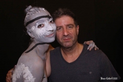 Andy Golub  Artist paints models for a living mural in his art space.