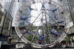 The members of the STREB Extreme Action company perform on a giant rotating wheel in an experimental dance piece entitled "Kaleidoscope" inside the public plaza of the Manhattan West Plaza at 395 9th Ave in Manhattan NY on September 17, 2021. (Photo by Andrew Schwartz)