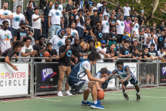 The Blue Chips basketball teams from the 111th (blue jersey) and 17th (white jersey) NYPD precincts compete for the championship title at Dyckmann Park. (Photo by Gabriele Holtermann)