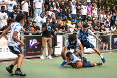 The Blue Chips basketball teams from the 111th (blue jersey) and 17th (white jersey) NYPD precincts compete for the championship title at Dyckmann Park. (Photo by Gabriele Holtermann)