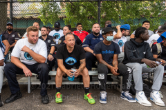 Players, coaches, and NYPD officers watch the Blue Chips basketball championship game between the 17th and 111th Precinct. (Photo by Gabriele Holtermann)
