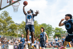 The Blue Chips basketball teams from the 111th (blue jersey) and 17th (white jersey) NYPD precincts compete for the championship title at Dyckmann Park. (Photo by Gabriele Holtermann)