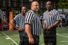 The Blue Chips basketball teams from the 111th (blue jersey) and 17th (white jersey) NYPD precincts compete for the championship title at Dyckmann Park. (Photo by Gabriele Holtermann)