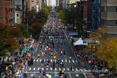 NYC Marathon runners pass under the 59th St Bridge and up 1st Avenue during the 2021 NYC Marathon.