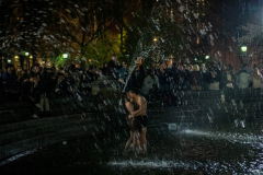 NEW YORK, NEW YORK - APRIL 10: Two people kiss while standing in the Washington Square Park fountain while crowds of people drink alcohol and dance in Washington Square Park amid the coronavirus pandemic on April 10, 2021 in New York City. This is the second consecutive night that police have broken up large crowds partying in Washington Square Park. After undergoing various shutdown orders for the past 12 months the city is currently in phase 4 of its reopening plan, allowing for the reopening of low-risk outdoor activities, movie and television productions, indoor dining as well as the opening of movie theaters, all with capacity restrictions. (Photo by Alexi Rosenfeld/Getty Images)