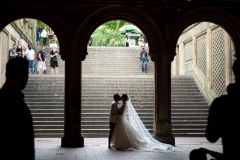 NEW YORK, NEW YORK - JULY 24: A bride and Groom take wedding photos near the Bethesda Fountain in 3Central Park West on July 24, 2021 in New York City. Couples were out in droves taking wedding and engagement photos as the wedding industry sees a spike in nuptial celebrations as more people are receiving COVID-19 vaccinations.  (Photo by Alexi Rosenfeld/Getty Images)