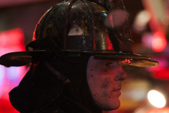 A firefighter from Rescue Company 2 is covered in soot after working at a three alarm fire at 2819 Tilden Avenue.
Photo by Lloyd Mitchell