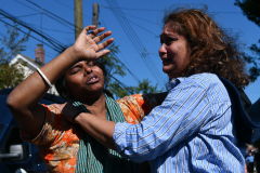 Residents react after a mom and son were killed during flooding in their basenment at 90-11 183 Street.