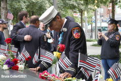 New York, 9.11 20th Anniversary Ceremony held at Ground Zero. Families and Friends gather to hear the names of the victims of the World Trade Center Attack. Families place flowers and photographs on the names of the victims.