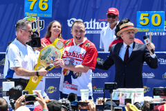 Joey Chestnut breaks his record by eating 76 hot dogs in 10 minutes at the 2021 NathanÕs Hot Dog Eating Contest at Coney Island.