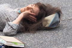 A bicycle delivery man went thru a red light in Columbus Circle and knocked over a woman, injuring her in NYC on 11 May 2022.
