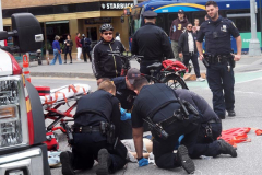 A bicycle delivery man went thru a red light in Columbus Circle and knocked over a woman, injuring her in NYC on 11 May 2022.