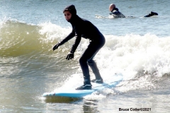 NEW YORK -  Black Surfers Association have a paddle out to honor George Floyd and Daunte Wright in Far Rockaway Queens at Beach 91st. Street. Surfers take to the water hold a prayer circle and place flowers in the water while family members and friends hold signs on the beach.