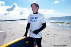 NEW YORK -  Black Surfers Association have a paddle out to honor George Floyd and Daunte Wright in Far Rockaway Queens at Beach 91st. Street. Surfers take to the water hold a prayer circle and place flowers in the water while family members and friends hold signs on the beach.