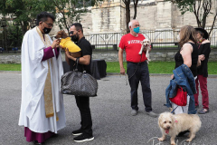A man and his Dauschund at The blessing of animals at Cathedral Church of St. John The Divine. The Blessing Of The Animals is connected with World Animal Day , which is also the Catholic day of remembrance for Saint Francis of Assisi. The founder of the Franciscan Order is considered the patron saint of animals