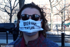 New York - Breonna Taylor Memorial and march to commemorate the one year anniversary of her death by police. Marchers held signs and red roses as they walk thru the streets of Brooklyn.