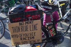 New York - Breonna Taylor Memorial and march to commemorate the one year anniversary of her death by police. Marchers held signs and red roses as they walk thru the streets of Brooklyn.