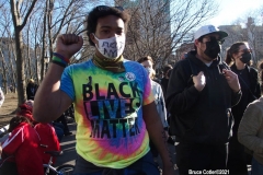 New York - Breonna Taylor Memorial and march to commemorate the one year anniversary of her death by police. Marchers held signs and red roses as they walk thru the streets of Brooklyn.