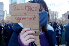 New York - Breonna Taylor Memorial and march to commemorate the one year anniversary of her death by police. Marchers held signs and red roses as they walk thru the streets of Brooklyn.