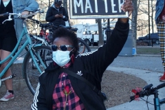 New York - Breonna Taylor Memorial and march to commemorate the one year anniversary of her death by police. Marchers held signs and red roses as they walk thru the streets of Brooklyn.