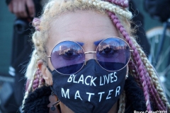 New York - Breonna Taylor Memorial and march to commemorate the one year anniversary of her death by police. Marchers held signs and red roses as they walk thru the streets of Brooklyn.