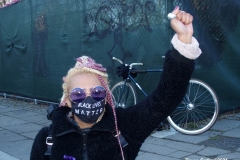 New York - Breonna Taylor Memorial and march to commemorate the one year anniversary of her death by police. Marchers held signs and red roses as they walk thru the streets of Brooklyn.