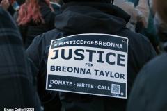 New York - Breonna Taylor Memorial and march to commemorate the one year anniversary of her death by police. Marchers held signs and red roses as they walk thru the streets of Brooklyn.