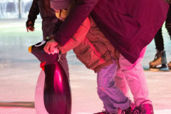 The father is teaching his child how to ice skate at Bryant Park, New York City on 12 Jan 2022, 
Photo by Manoli Figetakis