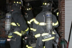 New York City. FDNY personnel extinguish a garage fire on East 29th Street and Kings Highway.