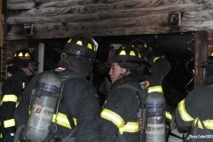 New York City. FDNY personnel extinguish a garage fire on East 29th Street and Kings Highway.