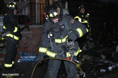 New York City. FDNY personnel extinguish a garage fire on East 29th Street and Kings Highway.