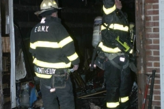 New York City. FDNY personnel extinguish a garage fire on East 29th Street and Kings Highway.