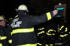 New York City. FDNY personnel extinguish a garage fire on East 29th Street and Kings Highway.