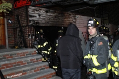 New York City. FDNY personnel extinguish a garage fire on East 29th Street and Kings Highway.