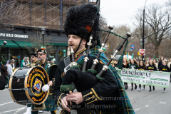 A bagpipe player marches in the St. Patrick's Day Parade in the Park Slope neighborhood of Brooklyn, NY, on Mar. 20, 2022. (Photo by Gabriele Holtermann)
