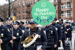 The NYPD Marching Band attend the St. Patrick's Day Parade in the Park Slope neighborhood of Brooklyn, NY, on Mar. 20, 2022. (Photo by Gabriele Holtermann)