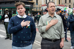 NY Assemblymember Robert 'Bobby' Carroll and NYC Comptroller Brad Lander sing the National Anthem before  the St. Patrick's Day Parade in the Park Slope neighborhood of Brooklyn, NY, on Mar. 20, 2022. (Photo by Gabriele Holtermann)