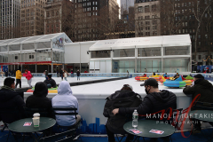 Visitors checking out Bumper Cars on Ice at Bryant Park, New York on 27 Jan 2022.