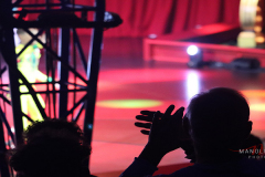 Audience member clapping after The Yab Brother performance in the  Big Apple Circus in Lincoln Center Plaza, New York City on 14 Jan 2022