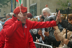 Republican mayoral candidate Curtis Sliwa "high fives" a spectator along the parade route.