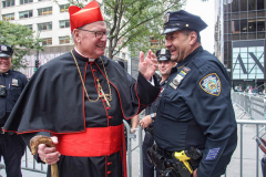 Cardinal Timothy M. Dolan laughs with Police Officer outside of St. Patrick’s Cathedral.
The annual Columbus Parade in NYC took place on between 42nd and 72nd on 5th avenue again this year, after last year’s COVID hiatus, attracting thousands of spectators to watch. The festivities were filled with an abundance of floats and key figure participants in the iconic parade also known as;  “US’s biggest Italian-American Heritage Parade.” 
President Biden also commemorated both today as both Columbus Day and National Indigenous Day.     (C) Bianca Otero. NYC. October 10, 2021.