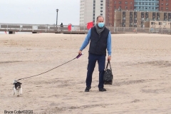 The Coney Island Polar Bear Club is the oldest winter bathing club in the United States founded in 1903. They swim every Sunday November-April at 1 PM. Walking his dog on the beach