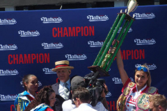 July 4  2022  NEW YORK  
Nathan's Famous Fourth of July International Hot Dog Eating Contest held at the corner of Surf ave. and Stillwell ave. where the original Nathan's Hot Dog stand opened over a hundred years ago. Miki Sudo winner eating 40 hot dogs and buns and in second place Michelle Lesco last years winner.