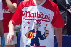 July 4  2022  NEW YORK  
Nathan's Famous Fourth of July International Hot Dog Eating Contest held at the corner of Surf ave. and Stillwell ave. where the original Nathan's Hot Dog stand opened over a hundred years ago.  Joey Chestnut win for the 15 year. eating 63 hot Dogs and Buns.