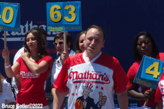 July 4  2022  NEW YORK  
Nathan's Famous Fourth of July International Hot Dog Eating Contest held at the corner of Surf ave. and Stillwell ave. where the original Nathan's Hot Dog stand opened over a hundred years ago.  Joey Chestnut win for the 15 year. eating 63 hot Dogs and Buns.